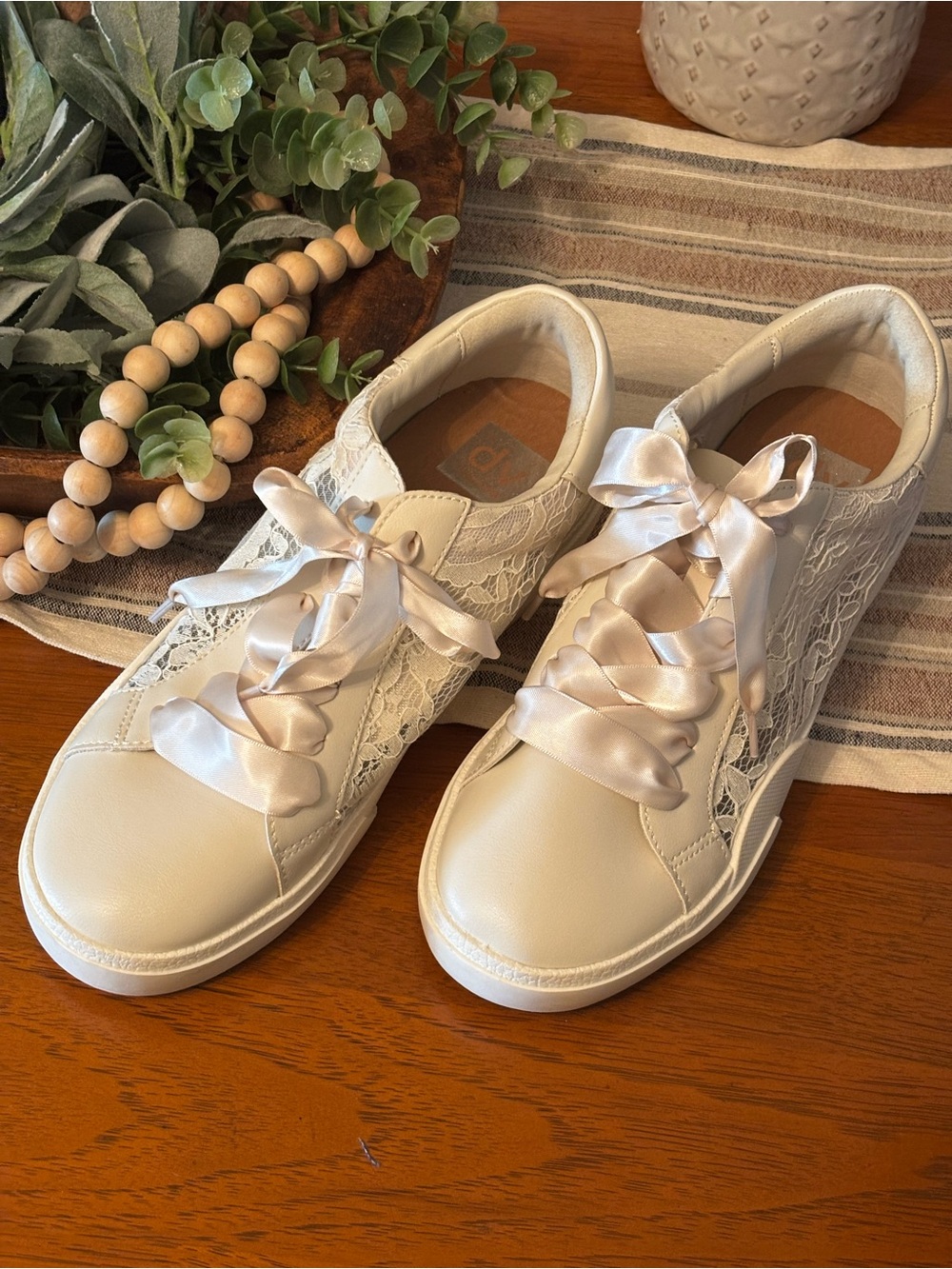 Like New! White lace, satin shoe strings Dolce Vita sneakers. Size 9 women’s.
